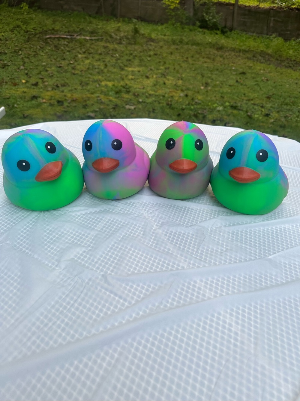 ONE Sunny Days Squeeezy tiedye duck jumbo squishy squeezy fidget toy multicolor